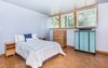 Modern home with Bedroom, Bed, Dresser, Shelves, Night Stands, Accent Lighting, Storage, Ceiling Lighting, and Cork Floor. Bedroom 1 Photo 16 of Classic Mid Century Modern home for sale