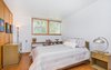 Modern home with Bedroom, Cork Floor, Accent Lighting, Ceiling Lighting, Table Lighting, Bed, Dresser, Night Stands, Storage, and Shelves. Bedroom 2 Photo 17 of Classic Mid Century Modern home for sale