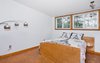 Modern home with Bedroom, Storage, Night Stands, Bed, Ceiling Lighting, Shelves, Accent Lighting, Floor Lighting, and Cork Floor. Master Bedroom/Original Au Pair Suite Photo 18 of Classic Mid Century Modern home for sale