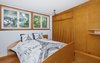 Modern home with Bedroom, Bed, Storage, Wardrobe, Shelves, Ceiling Lighting, Track Lighting, Accent Lighting, and Cork Floor. Master Bedroom/Original Au Pair Suite Photo 19 of Classic Mid Century Modern home for sale