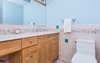 Modern home with Bath Room, Ceramic Tile Floor, Engineered Quartz Counter, Ceiling Lighting, Wall Lighting, One Piece Toilet, and Ceramic Tile Wall. European Style Baths Photo 20 of Classic Mid Century Modern home for sale