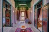Modern home with Bedroom, Limestone Floor, Table Lighting, Wall Lighting, Ceramic Tile Floor, Pendant Lighting, Porcelain Tile Floor, Travertine Floor, and Ceiling Lighting. Emerald suite Royal Riad marrakech Photo 2 of Riad Privilege Marrakech