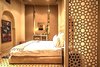 Modern home with Bedroom, Floor Lighting, Chair, Bed, Wall Lighting, Wardrobe, Pendant Lighting, Table Lighting, Porcelain Tile Floor, Accent Lighting, Limestone Floor, Ceiling Lighting, Travertine Floor, Night Stands, Ceramic Tile Floor, and Dresser. Royal Suite at Royalriad Marrakech Photo 9 of Riad Privilege Marrakech
