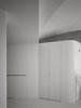 Modern home with Storage Room, Cabinet Storage Type, and Closet Storage Type. Shoe storage and audio equipment are blended into the partition. Thus, subordinate furniture is no longer independent but merged into the space Photo 4 of Fluid House