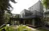 Modern home with Exterior, House Building Type, Concrete Siding Material, and Tile Roof Material. The design adopted the concept of "Building Block". Photo of Simple House