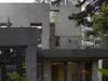 Modern home with House Building Type, Tile Roof Material, and Concrete Siding Material. Volumes were aligned obliquely that enabled more easily the interior to extend to the exterior from time to time. Photo 6 of Simple House