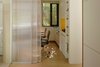 Modern home with Office, Study Room Type, Chair, Bookcase, Desk, and Medium Hardwood Floor. A work space is designed next to the bedroom. Photo 15 of Simple House