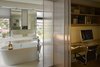 Modern home with Bath Room, Freestanding Tub, Open Shower, Engineered Quartz Counter, Ceramic Tile Floor, Vessel Sink, Ceiling Lighting, Recessed Lighting, Accent Lighting, Ceramic Tile Wall, and One Piece Toilet. With an abundant application of the glass, natural light could sufficiently diffuse into the interior which made it even more possible for the communication between the interior scene and the exterior green. Photo 17 of Simple House