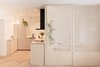 Modern home with Kitchen, Undermount Sink, Wood Counter, Dishwasher, Ceiling Lighting, Medium Hardwood Floor, Refrigerator, and Wood Cabinet. Closed bedroom for full privacy. Sound and light proof curtains can be available inside. Photo 6 of Scandinavian/Japanese concept home in Oslo city center
