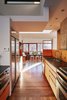 Modern home with Kitchen, Wood Cabinet, Medium Hardwood Floor, Refrigerator, Undermount Sink, Stone Counter, Recessed Lighting, and Ceiling Lighting. 'Mountain House' - Kitchen Natural Light Photo 9 of Mountain House Modern