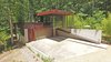 Modern home with Metal Roof Material, Concrete Siding Material, Metal Siding Material, Living Space Room Type, Garage, and Detached Garage Room Type. 'Tree House' Photo of Mountain House Modern