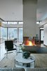 Modern home with Living Room, Medium Hardwood Floor, Two-Sided Fireplace, and Wood Burning Fireplace. 'Mountain House' - Winter Living Photo 8 of Mountain House Modern