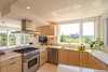 Modern home with Kitchen, Ceiling Lighting, Range, Wood Cabinet, Drop In Sink, Dishwasher, Range Hood, and Cooktops. Kitchen with industrial stove and energy-efficient appliances Photo 8 of Amagansett Beach House