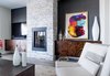Modern home with Living Room, Chair, Console Tables, Coffee Tables, Floor Lighting, Recessed Lighting, Gas Burning Fireplace, and Porcelain Tile Floor. Fireplace wrapped in 'Princess White' stacked Quartzite Photo 2 of Vegas Luxe