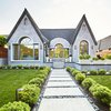 Modern home with Outdoor, Front Yard, Grass, Hardscapes, Walkways, Shrubs, Horizontal Fences, Wall, Gardens, Landscape Lighting, Tile Patio, Porch, Deck, and Hanging Lighting. Exterior Photo of West Hollywood Tudor