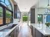 Modern home with Kitchen, Marble Counter, Colorful Cabinet, Light Hardwood Floor, Recessed Lighting, Porcelain Tile Backsplashe, Refrigerator, Pendant Lighting, Undermount Sink, Dishwasher, and Wine Cooler. Kitchen Photo 5 of West Hollywood Tudor