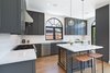 Modern home with Kitchen, Marble Counter, Porcelain Tile Backsplashe, Light Hardwood Floor, Colorful Cabinet, Recessed Lighting, Range, Pendant Lighting, Range Hood, Refrigerator, Dishwasher, Undermount Sink, and Wine Cooler. Kitchen Photo 6 of West Hollywood Tudor