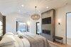 Modern home with Bedroom, Bed, Chair, Recessed Lighting, Bench, Ceiling Lighting, Wall Lighting, Carpet Floor, and Light Hardwood Floor. Master Bedroom Photo 7 of West Hollywood Tudor