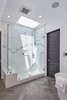 Modern home with Bath Room, Corner Shower, Freestanding Tub, Undermount Sink, Porcelain Tile Floor, One Piece Toilet, Marble Counter, and Porcelain Tile Wall. Master Bathroom Shower Photo 9 of West Hollywood Tudor