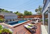 Modern home with Outdoor, Swimming Pools, Tubs, Shower, Raised Planters, Back Yard, Small Pools, Tubs, Shower, Large Patio, Porch, Deck, Salt Water Pools, Tubs, Shower, Decking Patio, Porch, Deck, Wood Patio, Porch, Deck, Wood Fences, Wall, Landscape Lighting, and Horizontal Fences, Wall. Back yard, Pool deck Photo 15 of West Hollywood Tudor