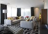 Modern home with Living Room, Sofa, Ottomans, Coffee Tables, Floor Lighting, Bookcase, Two-Sided Fireplace, Ceiling Lighting, and Wood Burning Fireplace. Living room Photo 8 of Rock'n Roll