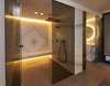 Modern home with Bath Room, Wall Mount Sink, Stone Counter, Wall Lighting, Ceiling Lighting, and One Piece Toilet. Spa, stone works blanc carrare, France Photo 14 of Rock'n Roll