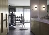 Modern home with Bath Room, Wall Mount Sink, Drop In Tub, Stone Counter, Wall Lighting, and Ceiling Lighting. Fitness room Photo 16 of Rock'n Roll