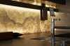 Modern home with Kitchen, Stone Counter, Wood Cabinet, Terrazzo Floor, Wall Lighting, and Undermount Sink. lit Onyx stone back splash Photo of The house ISIS