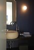 Modern home with Bath Room, Wood Counter, Terrazzo Floor, Drop In Tub, One Piece Toilet, Vessel Sink, and Wall Lighting. Guest toilet Photo 6 of The house ISIS