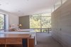 Modern home with Bedroom, Dresser, Bed, Wall Lighting, Shelves, Storage, and Bookcase. Master Suite Photo 6 of Oaks Parkhouse