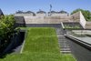 Modern home with Outdoor, Grass, Trees, Back Yard, Horizontal Fences, Wall, Wood Patio, Porch, Deck, Wood Fences, Wall, and Slope. Play surface and "hill" covers garage Photo 5 of Mohawk House
