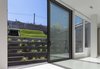 Modern home with Exterior, Metal, Sliding Door Type, Kids Room, and Living Room. Basement connects to back yard Photo 7 of Mohawk House