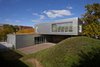 Modern home with Outdoor, Back Yard, Trees, and Grass. Dwelling connects green roof to mound Photo 2 of Morgan Street Live/Work