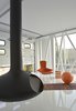 Modern home with Living Room, Wood Burning Fireplace, Hanging Fireplace, and Chair. Fireorb hovers above white epoxy concrete floor Photo 6 of Morgan Street Live/Work