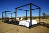 Modern home with Bedroom and Dark Hardwood Floor. Folding wooden cube frames in convertible mode Photo 6 of Joshua Tree Case Study Cabin