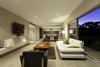 Modern home with Living Room, Chair, Ceiling Lighting, Sofa, Coffee Tables, Recessed Lighting, Floor Lighting, Pendant Lighting, Concrete Floor, and Gas Burning Fireplace. Cook. Eat. Chill. zone - mishacks' modular design system. (flaming bio fire) Photo 4 of 01 White Shack.