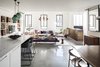 Modern home with Living Room, Chair, Sofa, Bench, Ottomans, Recliner, Coffee Tables, Bookcase, Media Cabinet, Table, Stools, Shelves, Pendant Lighting, and Concrete Floor. The Charm Townhouse - Ground floor - one big open space Photo 5 of The Charm Townhouse
