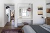 Modern home with Bedroom, Pendant Lighting, Bed, Table Lighting, Medium Hardwood Floor, and Dresser. The Charm Townhouse - First floor - master bedroom Photo 11 of The Charm Townhouse