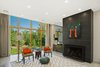 Modern home with Living Room, Chair, End Tables, Coffee Tables, Ceiling Lighting, Recessed Lighting, Floor Lighting, Concrete Floor, Standard Layout Fireplace, and Two-Sided Fireplace. Living area Photo 3 of The Milton House