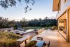 Modern home with Outdoor, Trees, Swimming Pools, Tubs, Shower, Back Yard, Post Lighting, Gardens, Large Pools, Tubs, Shower, Grass, Flowers, Lap Pools, Tubs, Shower, Large Patio, Porch, Deck, Wood Patio, Porch, Deck, Stone Patio, Porch, Deck, Landscape Lighting, Infinity Pools, Tubs, Shower, and Walkways. The property is listed with Hugh Evans III (310.500.1331) and Randy Forbes, Jr. (310.345.7082), both with Pacific Union International. For a look inside the property, visit 1143ravoli.com. Photo 7 of The Quintessence of Luxe California Living in Pacific Palisades