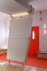 Modern home with Living Room, Storage, Ceiling Lighting, Bench, Carpet Floor, Wall Lighting, and Plywood Floor. Folding entry wall (down) Photo 3 of Facade/Fasad