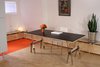 Modern home with Office, Study, Chair, Storage, Lamps, Plywood Floor, Carpet Floor, and Desk. Custom multi-mode table being used as desk Photo 5 of Facade/Fasad