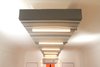Modern home with Living Room, Wall Lighting, and Ceiling Lighting. Soffit looking toward entry from rear of main multi-mode room Photo 16 of Facade/Fasad