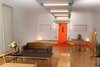 Modern home with Living Room, Chair, Sofa, Bench, Storage, Coffee Tables, Lamps, Ceiling Lighting, Desk, Carpet Floor, Plywood Floor, and Wall Lighting. Main multi-mode room looking toward entry set for living/home office Photo 17 of Facade/Fasad