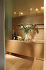 Modern home with Dining Room, Storage, Bench, Plywood Floor, and Table. Multi-mode rear room set for serving Photo 20 of Facade/Fasad
