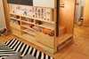 Modern home with Kids Room, Bedroom Room Type, Playroom Room Type, Storage, Shelves, Bookcase, Medium Hardwood Floor, Pre-Teen Age, Boy Gender, and Neutral Gender. Close-up stair to sleeping loft with storage compartments, including back-lit acrylic display box Photo 7 of LO Residence Playroom/Bedroom
