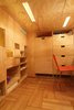 Modern home with Bedroom, Storage, Shelves, Medium Hardwood Floor, Accent Lighting, and Recessed Lighting. Storage under sleeping loft with recessed lighting Photo 11 of LO Residence Playroom/Bedroom