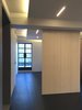 Modern home with Living Room, Ceiling Lighting, Dark Hardwood Floor, Accent Lighting, and Recessed Lighting. Elongated living room looking East with room divider panels and terrace door beyond Photo 5 of MB Residence (Nearing Completion)