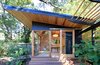 Modern home with Horizontal Fences, Wall, Console Tables, End Tables, Accent Lighting, Ceiling Lighting, Living Space Room Type, and Outdoor. The Shudio Exterior. Photo 3 of The Shudio