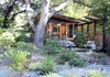 Modern home with Back Yard, Slope, Garden, Flowers, Shrubs, Living Space Room Type, and Shed & Studio. The Shudio and patio with privacy trellis. Photo of The Shudio
